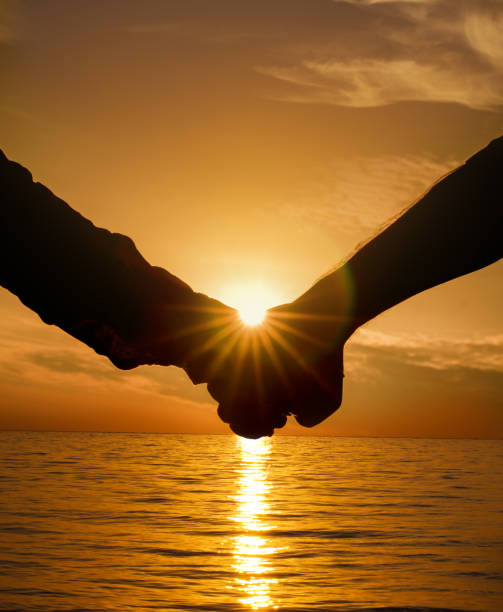 istock Young couple in love enjoying the view on beach 690304472