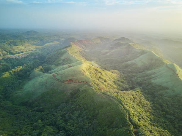 istock Scenic panorama aerial view on green hills 690311154