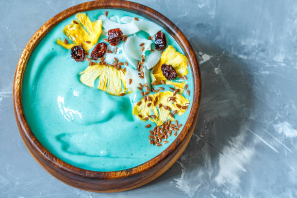 istock Blue spirulina smoothie bowl with pineapple and coconut. 690311274