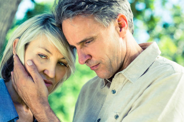 istock Loving man comforting woman 690312666
