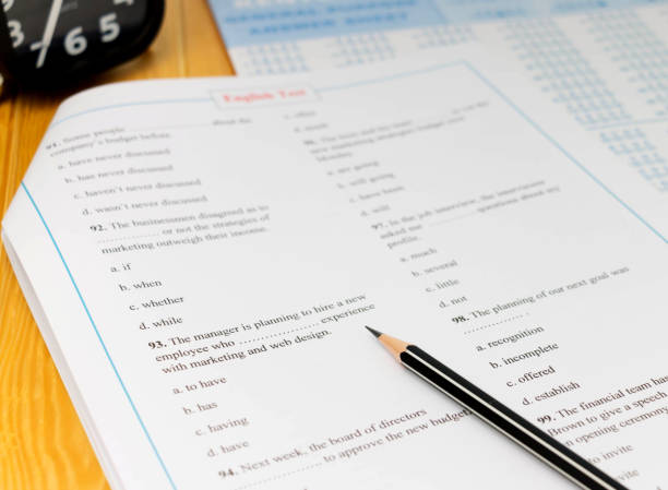 test english test on table with pencil exam paper stock pictures, royalty-free photos & images