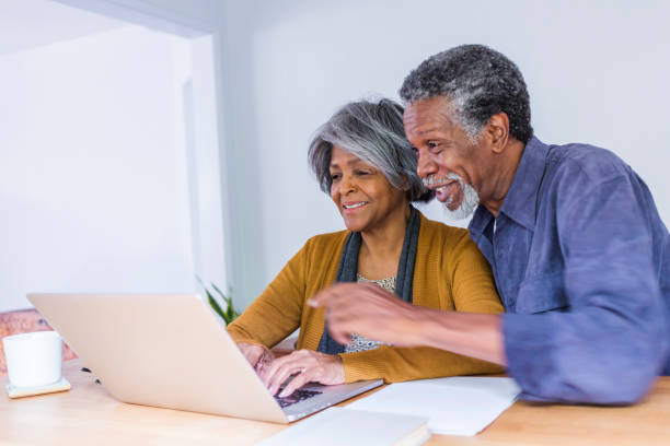 istock Senior African American Couple Doing Home Finances on Computer 690315510