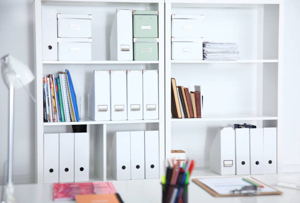 istock Modern office interior with tables, chairs and bookcases 690316086