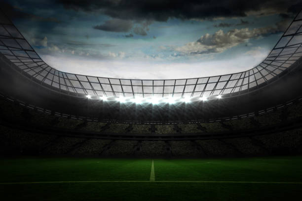 istock Large football stadium under blue sky 690317538