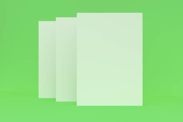 istock Three blank white closed brochure mock-up on green background 690322682