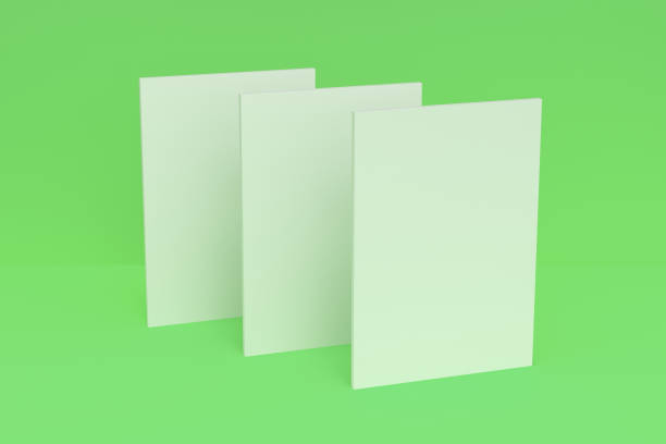 istock Three blank white closed brochure mock-up on green background 690322866