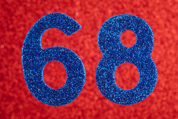 istock Number sixty-eight blue color over a red background. Anniversary. 690325432