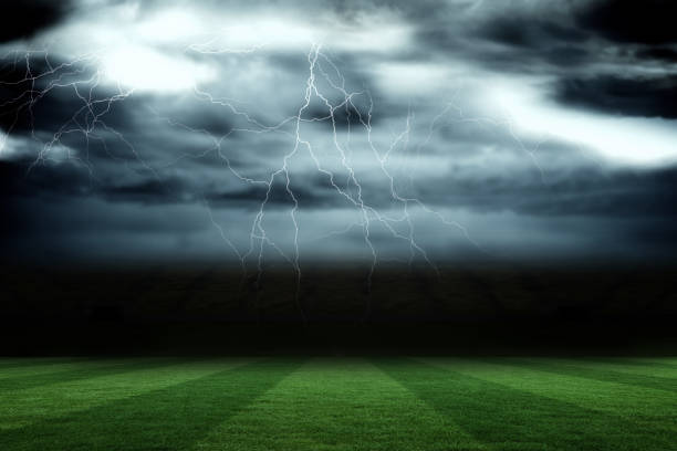 istock Football pitch under stormy sky 690333046