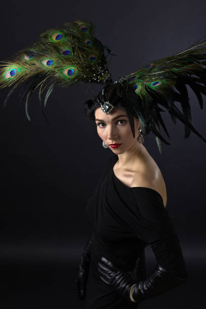 istock beautiful woman in retro style with feather decration 690333582