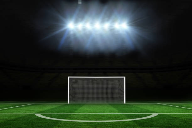 istock Football pitch under spotlights 690333852