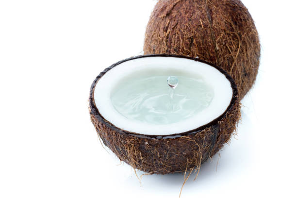 istock fresh ripe tropical coconuts with water isolated on white, coconut 690333942