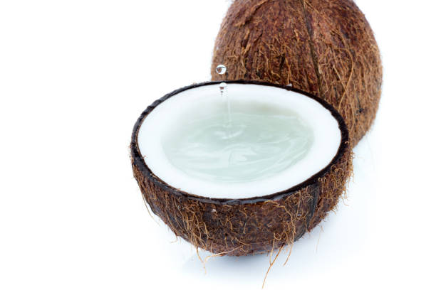 istock fresh ripe tropical coconuts with water isolated on white, coconut 690334052