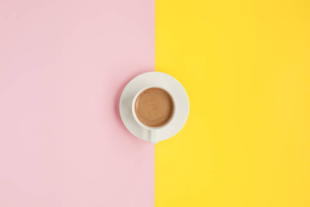 istock Cup of coffee on colorful surface 690336334