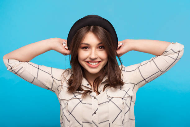 istock Stylish girl in hat on blue 690336976