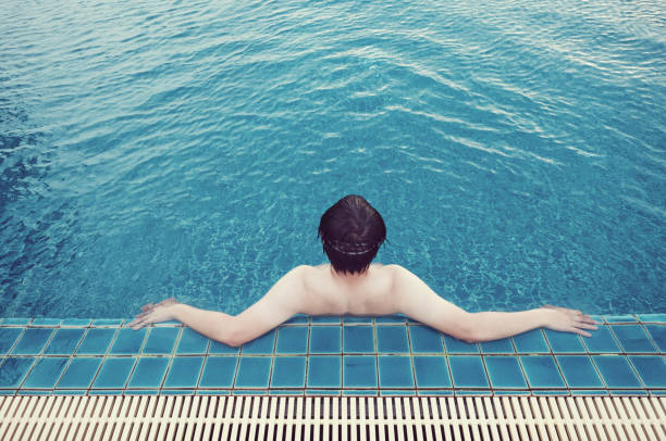 blue swimming pool at hotel with stair
