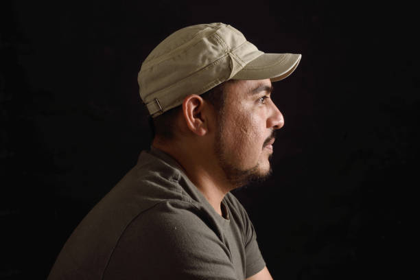 istock Portrait of a latin man on black background 690338728