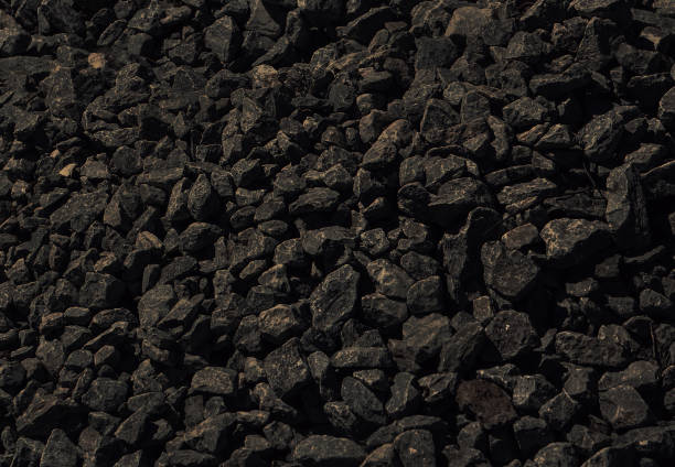 black background of dark stone. black background of dark stone. The texture is not smooth black stone. hard bituminous coal stock pictures, royalty-free photos & images