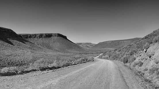 A dirt road winds through the wilderness in the Northern Cape, South Africa