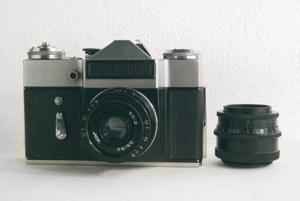 istock Old Soviet film camera with lens on white background close-up 690356056
