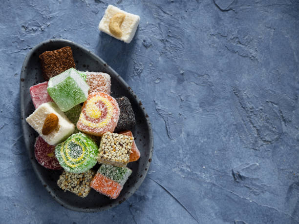 istock Turkish delight on blue concrete background, copy space 690357460