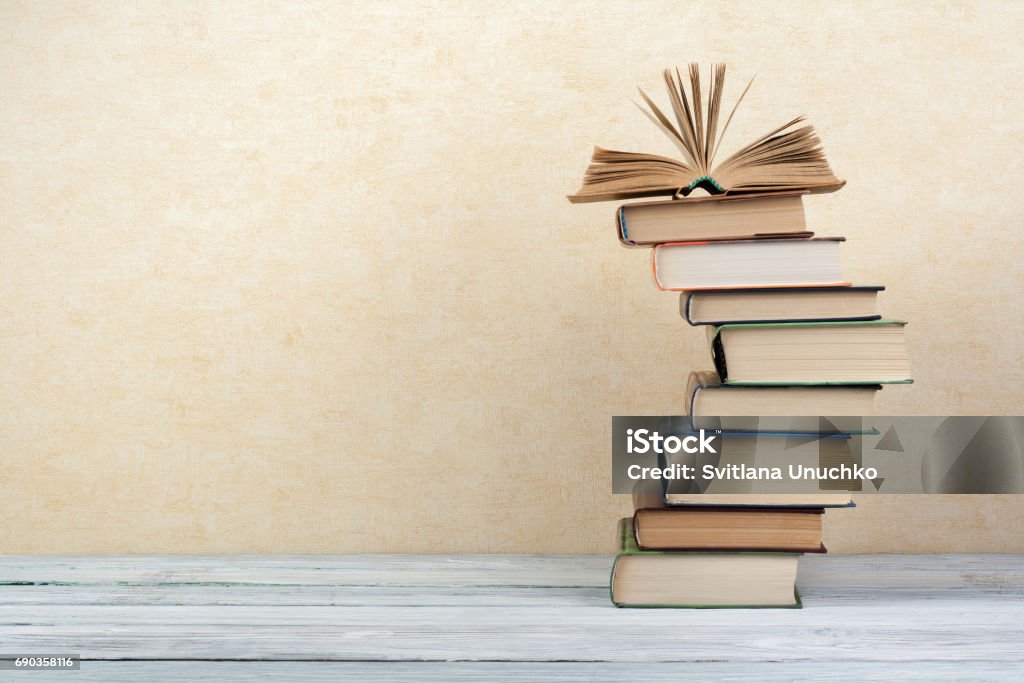 Stack of colorful books. Education background. Back to school. Book, hardback colorful books on wooden table. Education business concept. Copy space for text Stack Stock Photo