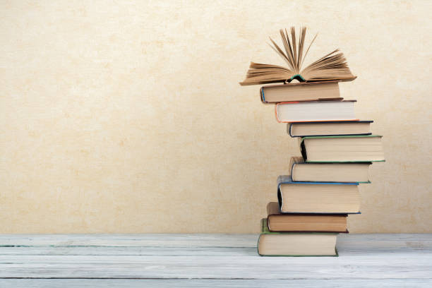 stack of colorful books. education background. back to school. book, hardback colorful books on wooden table. education business concept. copy space for text - bookstore book store stack imagens e fotografias de stock