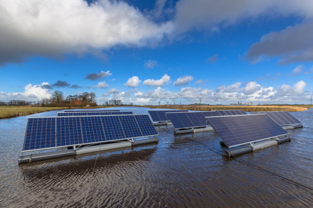 istock Series of Solar panels floating on water 690360304
