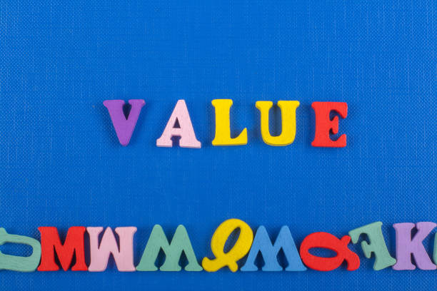 istock VALUE word on blue background composed from colorful abc alphabet block wooden letters, copy space for ad text. Learning english concept 690360432