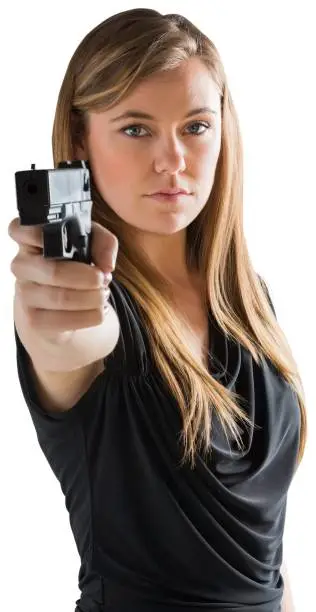 Photo of Femme fatale pointing gun at camera