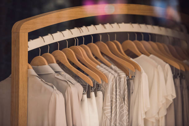 istock Fancy clothing on racks in a store in Paris. 690368190