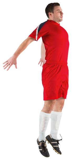 istock Football player in red jumping 690379484
