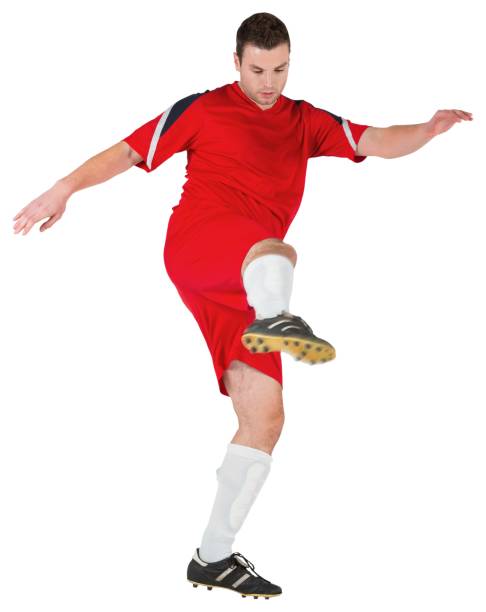 istock Football player in red kicking 690379606