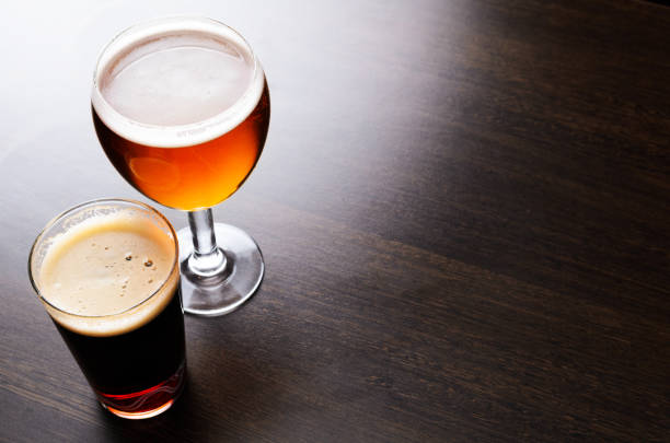 istock Glass of fresh beer on pub counter 690382858