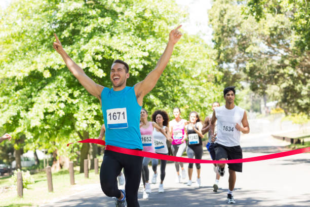 istock Runner crossing the finshline 690383128