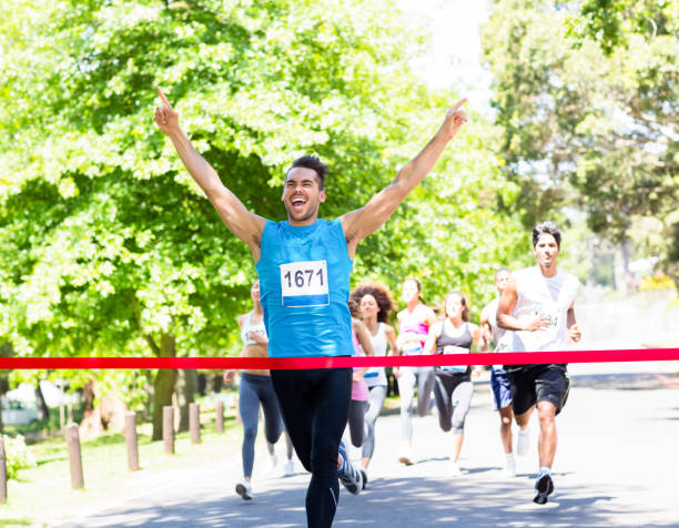 istock Runner crossing the finshline 690383152