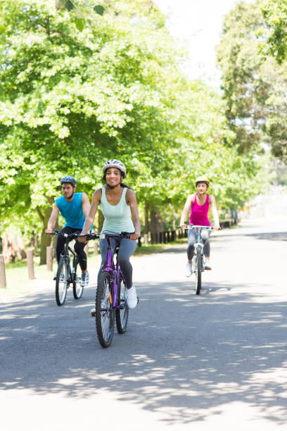 istock Cyclists cycling on country road 690384732