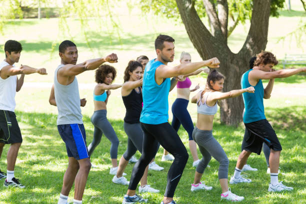 istock Friends exercising in park 690385866