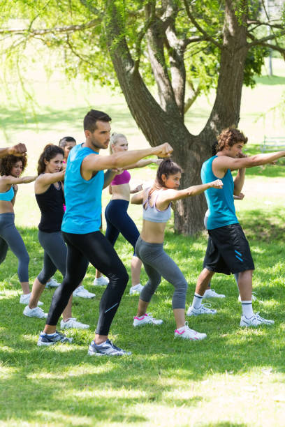 istock People exercising in the park 690385894