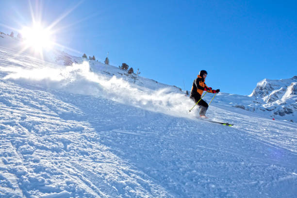 istock skier speeding down the mountain in a sunny day in Spain, Pyrenees 690389690