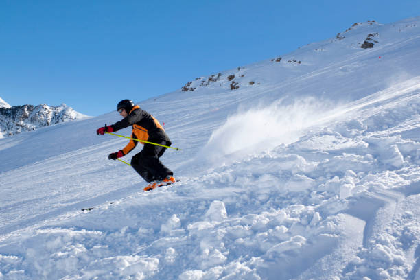 istock skier going down the mountain in Candanchu, Pyrenees, Spain 690390178