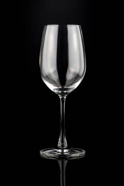 istock Empty wine glass isolated on a black background. 690390514