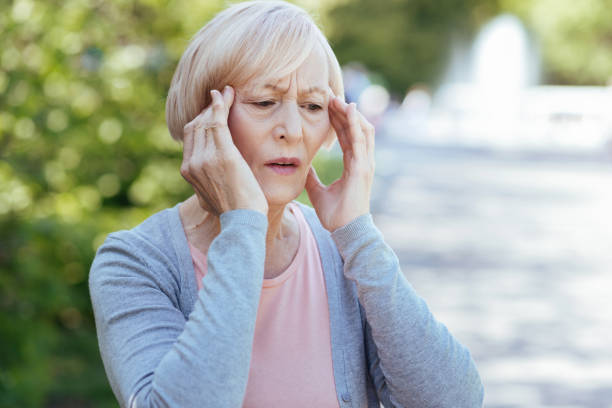 istock Worried pensioner having headache outdoors 690397690