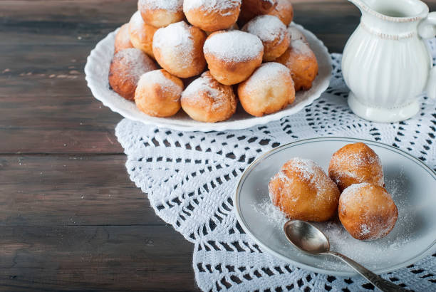 istock donuts laid out pyramid sprinkled with powdered sugar 690397984