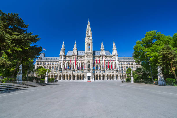 Vienna sights series, empty vienna town hall place blue sky no people The Vienna Town Hall in Austria - local Name: Wiener Rathaus. Shot on a perfect day without people and the place - rathausplatz - empty vienna city hall stock pictures, royalty-free photos & images