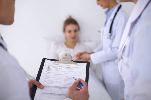 istock A group of doctors discussing medical history close up 690400870