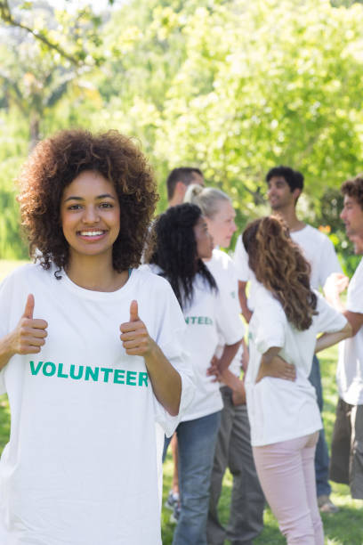 istock Female volunteer gesturing thumbs up 690403736