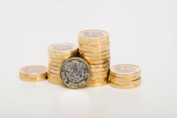 Pile of Pound coins Pile of new British Pound Sterling coins one pound coin uk coin british currency stock pictures, royalty-free photos & images