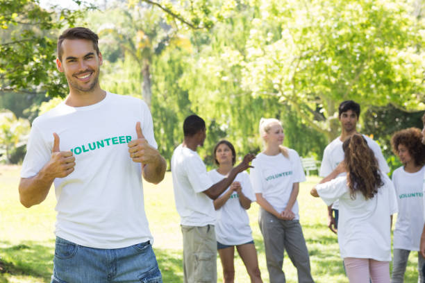 istock Handsome volunteer showing thumbs up 690403972