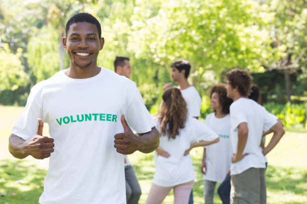 istock Smiling volunteer showing thumbs up 690404038