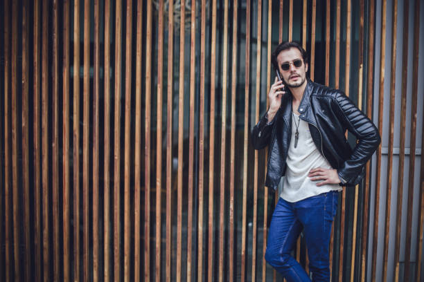 istock Handsome man talking on the phone 690404202